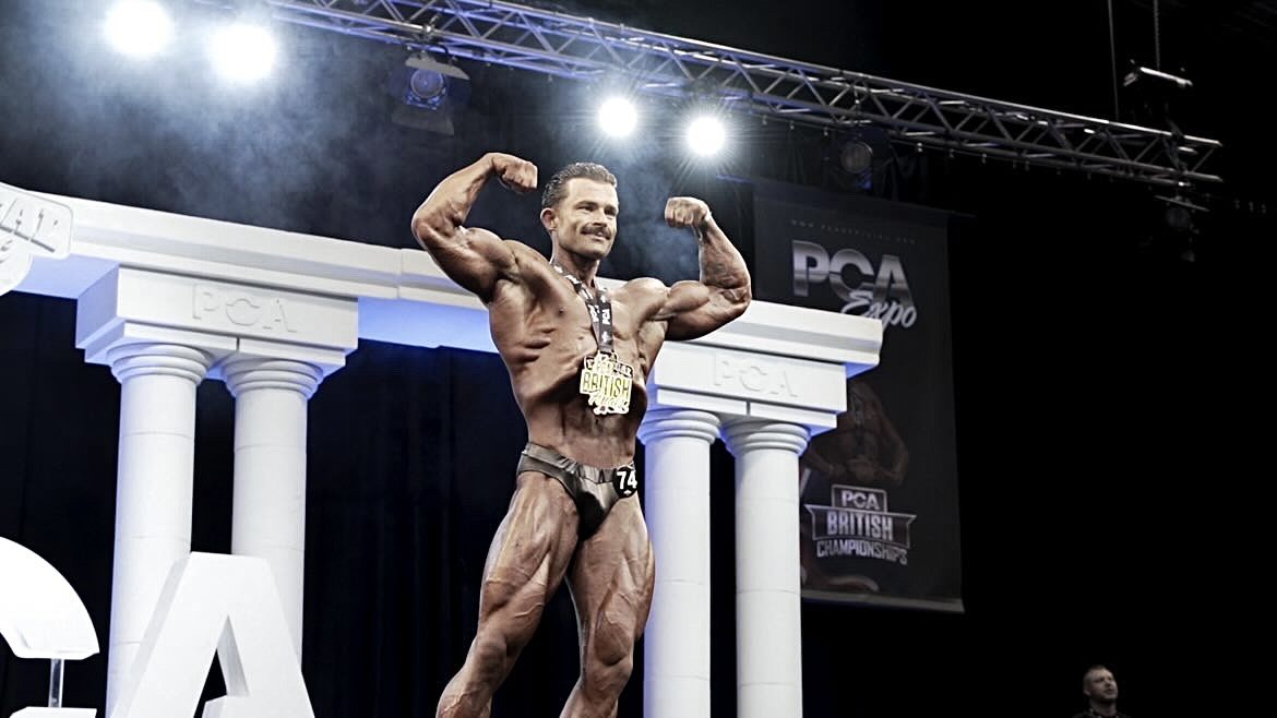 Sam on stage at the PCA British Championships with his medal